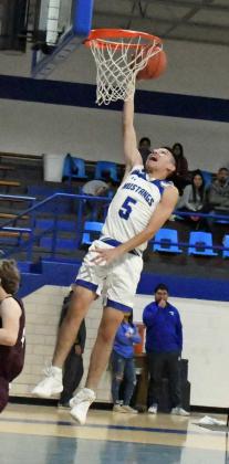 CLOSING OUT THE GAME – Olton’s Joe Canchola (5), closes out the fourth quarter with a fast-break lay-up for the Mustangs, as they took down Littelefield at home on Monday, 76-54. (Staff photo by Derek Lopez)