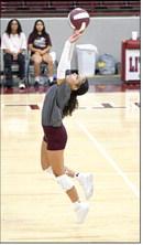 Littlefield’s Madison Williams sets a ball up in the air looking to set up an attack, during the first set of the Lady’Cat’s season-opening win over Dimmitt at Wildcat Gym. (Staff Photo by Derek Lopez)
