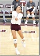 Littlefield’s Faith Balderas breaks a serve, during the first set of the Lady’Cat’s season-opening win over Dimmitt at Wildcat Gym. (Staff Photo by Derek Lopez)