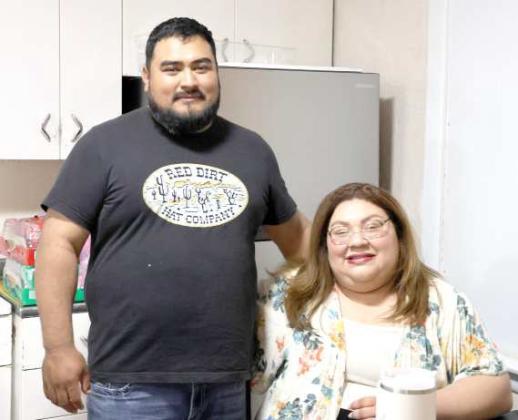 Eduardo and Marlene Moreno took orders and payments at the door during the Fundraiser at Amherst, Texas on Thursday, April 25, 2024. The Amherst Chamber of Commerce is raising money for new playground activity equipment for the Amherst City Park. (Photo by Ann Reagan)