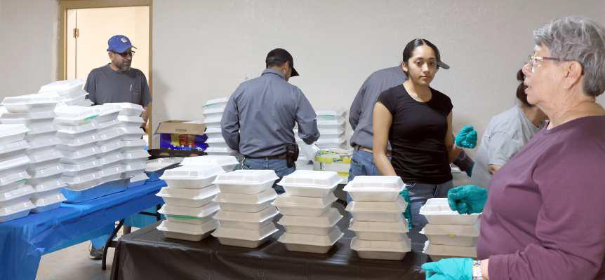 Rosa Logsdon along with the packing and serving crew during the Hamburger Fundraiser held in Amherst, Tx, on Thursday, April 25, 2024. (Photo by Ann Reagan)