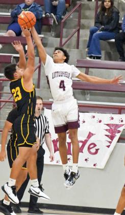 Littlefield senior, Kam McCarty (4), delivers a block against Snyder in the first quarter of their season-opener against the Tigers on Tuesday at Wildcat Gym. (Staff Photo by Derek Lopez)