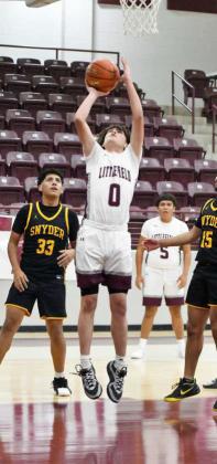 Littlefield’s Andrew Davis (0), drops in a lay-up, during the first half of their season-opener against the Tigers on Tuesday at Wildcat Gym. (Staff Photo by Derek Lopez)