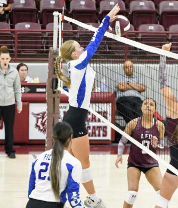 Olton’s Amie Beelitz deliveres a block against Littlefield, during their three-set match on Saturday at the Littlefield Tournament. (Staff Photo by Derek Lopez)