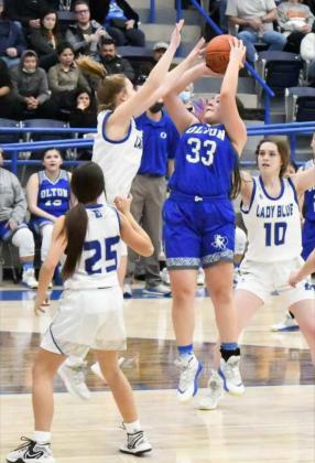 TOUGH SHOT - Olton junior, Karla Arriola (33), puts up a tough jumper in the lane over the Farwell defense, during the Fillies’ road loss to the Lady Blue on Friday. (Staff Photo by Derek Lopez)