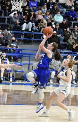 TRANSITION POINTS -01ton sophomore, Olivia Cox (21), drops in a lay-up in transition, during the second half of the Fillies’ road loss to the Lady Blue on Friday. (Staff Photo by Derek Lopez)