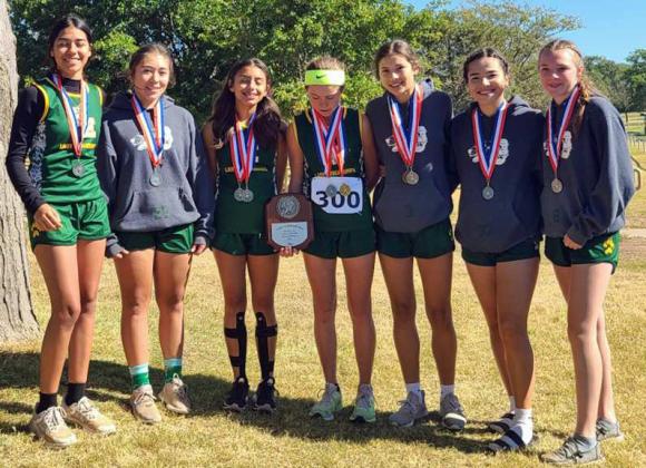 DISTRICT RUNNER-UPS – The Springlake-Earth Lady Wolverines’ varsity cross country team finished as the Runner-ups at the district 4-1A Cross Country Meet at Plainview on Tuesday. (Shown): Taytum Goodman, Aabriella Villanueva, Emma Samaron, Aryca Ibarra, Rylie Furr, Jenna Bridges and Marisela Rodriguez. (Submitted Photo)