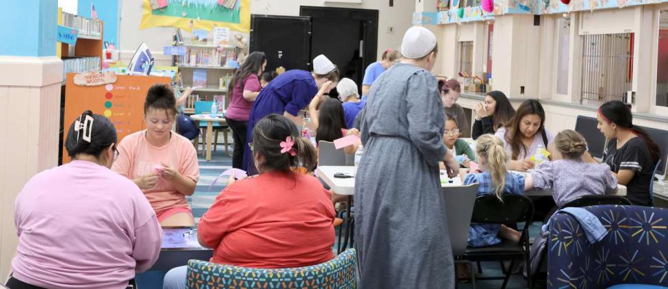 These ladies are having a good time learning different decorative stitching techniques during the Sewing Skills class at the Lamb County Library on Tuesday, July 16, 2024. The Sewing Skills with Sam class enjoyed a great turnout from girls and women of all ages. (Photos by Ann Reagan)