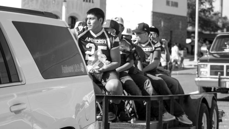 The Amherst football team participates in the annual Amherst celebration parade on July 25, 2026. (Photo by Madison Vidales)