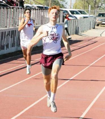 Sam Hill sprints across the finish line for Littlefield in the varsity boy’s 400-meter dash. ( Staff Photo by Derek Lopez)