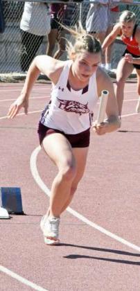 Kennadi Hanlin runs first leg of the 4x200- meter relay for Littlefield. (Staff Photo by Derek Lopez)