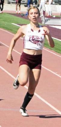 Lindsay Coffman sprints to the finish for Littlefield in the varsity girl’s 100-meter dash. (Staff Photo by Derek Lopez)