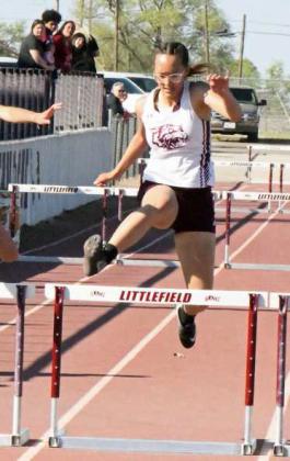 Littlefield’s Myli Hernandez jumps the last hurdle during the varsity girl’s 300meter hurdles at the Wildcat Relays last Friday. (Staff Photo by Derek Lopez)