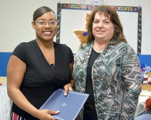Keeiona Shed, a Senior at Amherst High School was presented the Certificate of Scholarship from Jennifer Sawyer, President of the Amherst Chamber of Commerce at the Chamber Banquet held on Tuesday, March 28, 2023. (Photo by Ann Reagan)