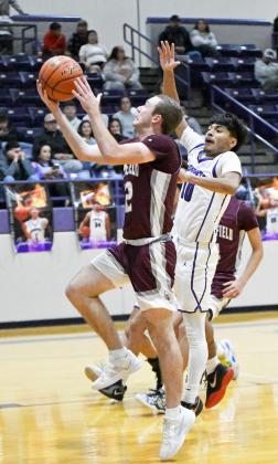 Chip Green beats the defense to the basket for a lay-up in transition for two of his 22 points on Friday, as the Wildcats took down Dimmitt on the road in their first meeting of the season. (Staff Photo by Derek Lopez)