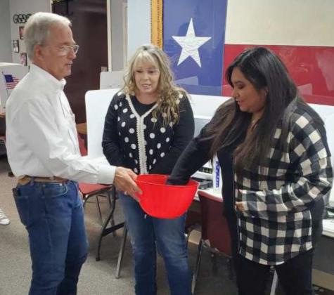 DRAWING FOR BALLOT SPOTS – Current District Clerk Debbie Long and her competitor Emily Castillo draw for ballot spots in the upcoming election. Long will be placed first on the ballot, followed by Castillo second. (Staff Photos by Derek Lopez)