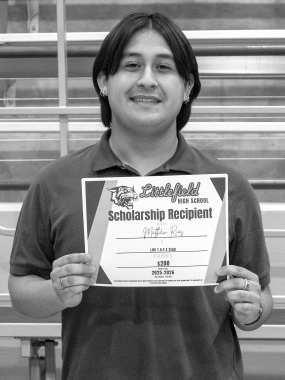 Matthew Rios receives a $200 scholarship from the LHS TAFE Club.