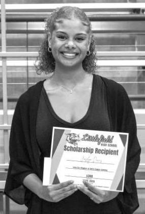 Joselyn Davis receives a $300 from the Iota Eta Chapter of Delta Kappa Gamma.