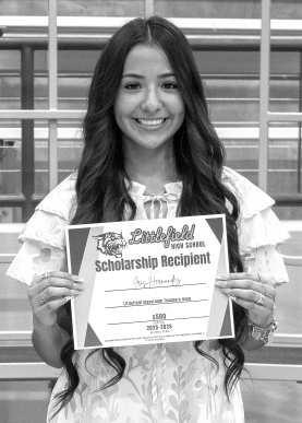 Iris Hernandez receives a $500 scholarship from the Littlefield Classroom Teachers Association.