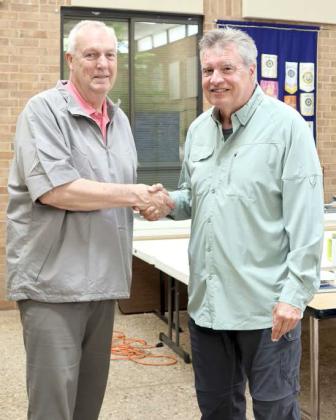 Tom Whistler was congratulated by John Roley of the Littlefield Rotary Club for his exemplary work as Principal of the Littlefield Elementary School at the Readers, Writers, and Reasoners awards ceremony held in the atrium of Lamb Healthcare Center on Thursday, April 25, 2024. Mr. Whistler will be retiring at the end of this term. (Photo by Ann Reagan)