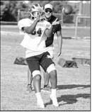 Springlake-Earth’s wide receivers work on their routes and catching passes, during the first week of two-a-days this past week. (Staff Photo by Derek Lopez)