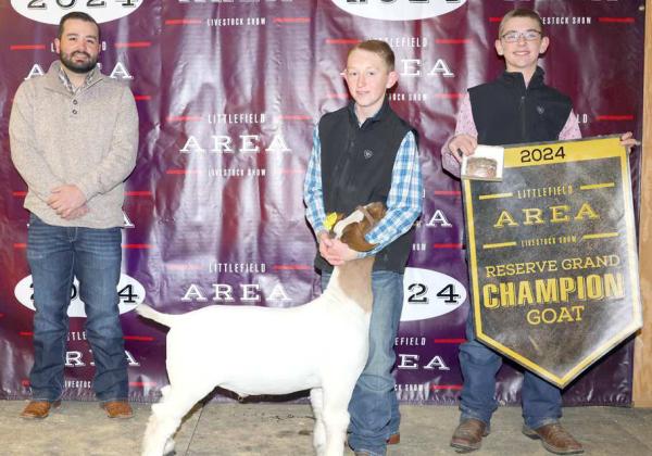 Ryan Muller of Littlefield 4-H won Reserve Grand Champion Goat at the Littlefield Area Junior Livestock Show on Friday at the Lamb County Ag Center. Shown with Judge Walker Hemphill (left). (Photo by MD Creations)