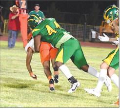 Springlake-Earth’s Victor Juarez Jr. makes a tackle behind the line of scrimmage, during the Wolverines’ home loss to Paducah last Friday at Wolverine Stadium. (Staff Photo by Derek Lopez)