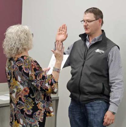 Graham Henley was sworn in on the Littlefield ISD School Board last Thursday. Shown is Henley reciting the oath after Jackie Milligan. (Staff Photo by Derek Lopez)