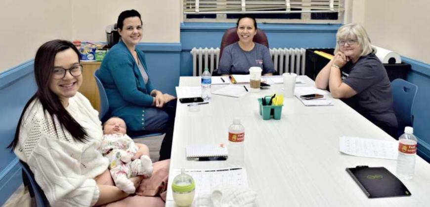 BOOK CLUB MEETS AT LIBRARY