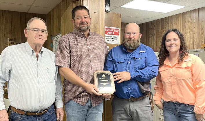 LAMB CO. SWCD FARMER OF THE YEAR AWARD -- Shown are two Lamb Co. SWCD Board members, Roy Thompson and Jason Spangler awarding Jamey Duesterhaus with the Lamb Co. SWCD Farmer of the Year Award recipient. Also shown on the left is Brenda May, NRCS Conservationist with Lamb County. The award was presented to Jamey during the May board meeting on Wednesday, May 7, 2025 at the NRCS office in Littlefield. (Submitted Photo)