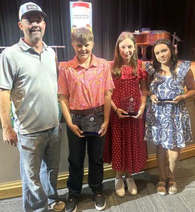 JR. ESSAY WINNERS FROM SUDAN ISD -- Shown from left to right: Jeff Edwards- Lamb Co. SWCD Board vice-chairman, Nicholas Carter- 2nd place Jr. essay winner, Yolanda Neufeld- 1st place Jr. essay winner, and Nyellie Montes- 3rd place Jr. essay winner. Jeff Edwards presented the awards during the award ceremony held at Sudan Elementary on Monday morning, May 12. (Submitted Photo)