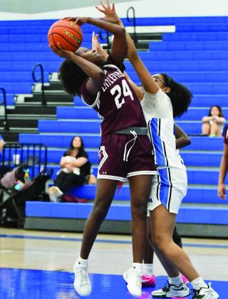 Littlefield’s Amoni Jefferson (24) goes up strong through contact for a lay-up, during the first half of the Lady Cats’ season-opening victory over the Lady Matadors last Saturday. (Staff Photo by Derek Lopez)
