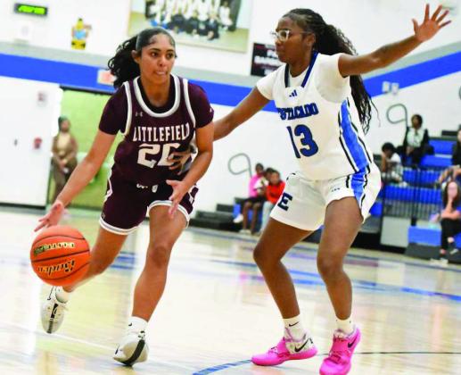 Littlefield’s Aubree Richardson (20) brings the ball down court, looking to get into their offense, during the first half of the Lady Cats’ season-opening victory over the Lady Matadors last Saturday. (Staff Photo by Derek Lopez)