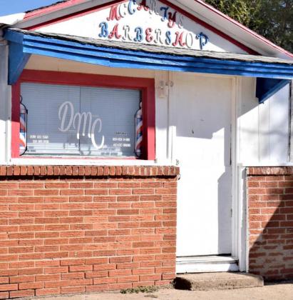 MCCARTY BARBER SHOP is located behind behind the McCarty Funeral Home. (Photo by Ann Reagan)