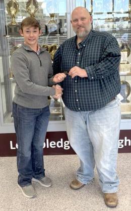 Clay Hollis, Lamb County Farm Bureau Agency Manager, right, awards Ty Carr Littlefield High School Ag Student for the Month of April. (Submitted Photo)