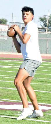 Littlefield quarterback, Nate Castaneda, drops back looking to complete a deep ball to the near side, during the Wildcats’ 7v7 match against Abernathy on Monday. (Staff Photo by Derek Lopez)