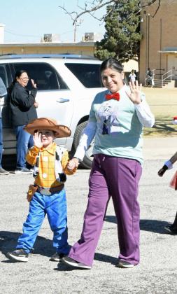 Students and staff walk in the Littlefield Primary Costume Parade on Thursday to celebrate Halloween. (Staff Photo by Derek Lopez)