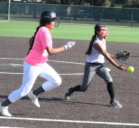 GETTING THE OUT – Littlefield 14u pitcher, Cali Saldana, fields a ball on the right side and flips it to first for the out, during their tournament match-up with the Sudan Nettes at Littlefield on Thursday afternoon. The 14u Lady Cats softball team fell to Sudan, ending their tournament. (Staff Photo by Derek Lopez)