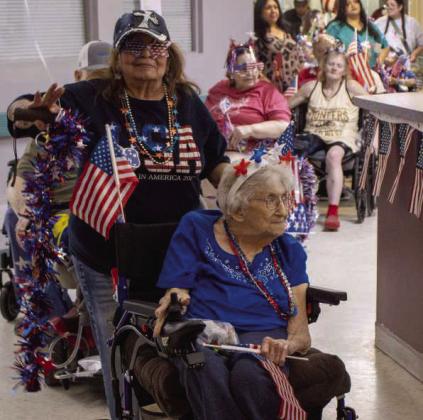 The Sunset Valley Rehab and Healthcare Center hosts a Fourth of July-themed parade featuring its residents on June 29, 2026. (Photos by Madison Vidales)