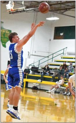 SHOWING THE RANGE - Olton senior guard, Jack Allcorn, fires up and drains a three from the right elbow, during the Mustangs road victory against Springlake-Earth last week at Wolverine Gym. (Staff Photo by Derek Lopez)