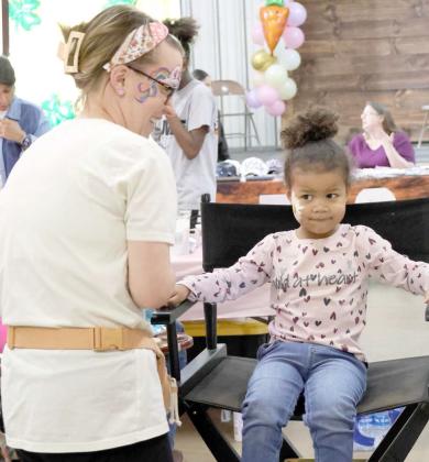This youngster is getting her face painted by a vendor at the marketing event held at Zeke's Event Center on Saturday, March 16, 2024. (Photo by Ann Reagan)