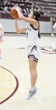 Littlefield’s Cali Saldana fires up a three from the left elbow, during the first half of the Lady Cats’, 35-31, district victory over Lamesa on Friday at Wildcat Gym. (Staff Photo by Derek Lopez)