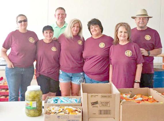Bree Clark, Violet Lopez, Sue Williamson, Johnny Williamson, Heather Johnson and Rich Allen. The Rotary Wildcat team were helpers at the Wildcat Street Party host by Wellington State Bank on Friday, Aug. 11. (Submitted Photo)