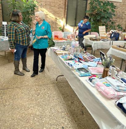 The Lamb Healthcare Center Auxiliary annual Bake Sale and Bazaar was held on Tuesday, Nov. 21 and Wednesday, Nov. 22 in the Atrium of the Lamb Healthcare Center. Shown is Margaret Duran, left, being assisted by Janice Sokora, right, on choosing items from the sale. (Submitted Photo)