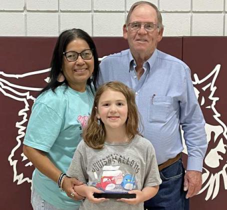 Summer Jenkins- (2nd grader) won 1st place in the Lamb Co. SWCD Poster Board Contest “Home is Where the Habitat Is”. She was presented her award during an Award ceremony held on Thursday, May 22, 2025 at 9:30am in the Littlefield Primary Cafeteria. Shown are Mrs. Lola Zapata-Primary Arts Teacher and Roy Thompson-Lamb Co. SWCD Board Member with Jenkins at the awards ceremony. (Submitted Photo)