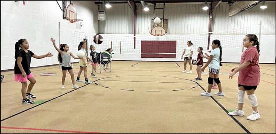 Future Lady Cat volleyball players work on their overhand hits during a drill, during the 1st session of the Littlefield Youth Volleyball Camp on monday morning. (Submitted Photo)