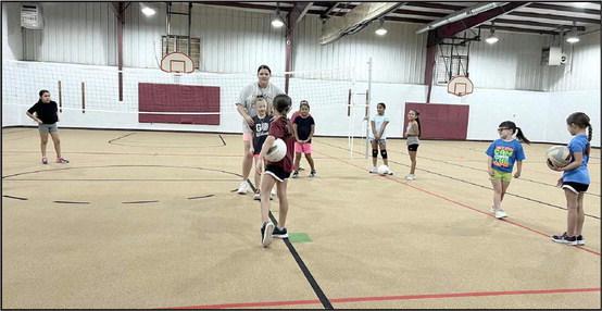 Littlefield Lady Cat Head Coach Kaylee Longoria gets her campers set for a drill, during the 1st session of the Littlefield Youth Volleyball Camp on monday morning. (Submitted Photo)