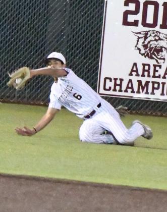 Littlefield left fielder, Gabriel Villanueva, makes a sliding catch in left field, during the top of the third inning of the Wildcat’s, 6-4, victory over New Deal on Thursday during the Lamb County Classic. (Staff Photo by Derek Lopez)