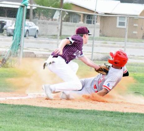 Littlefield third baseman, Chip Green, catches a laser from Major McNeese in right-center field, as he slaps the tag on the Mustangs base runner for an out during the Wildcats’ extra inning loss to the Mustangs in Denver City on Tuesday. (Staff Photo by Derek Lopez)