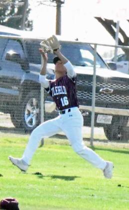 Littlefield left fielder, Gabe Montalvo, catches a fly ball on the leftfield line for an out during the Wildcats’ extra inning loss to the Mustangs in Denver City on Tuesday. (Staff Photo by Derek Lopez)